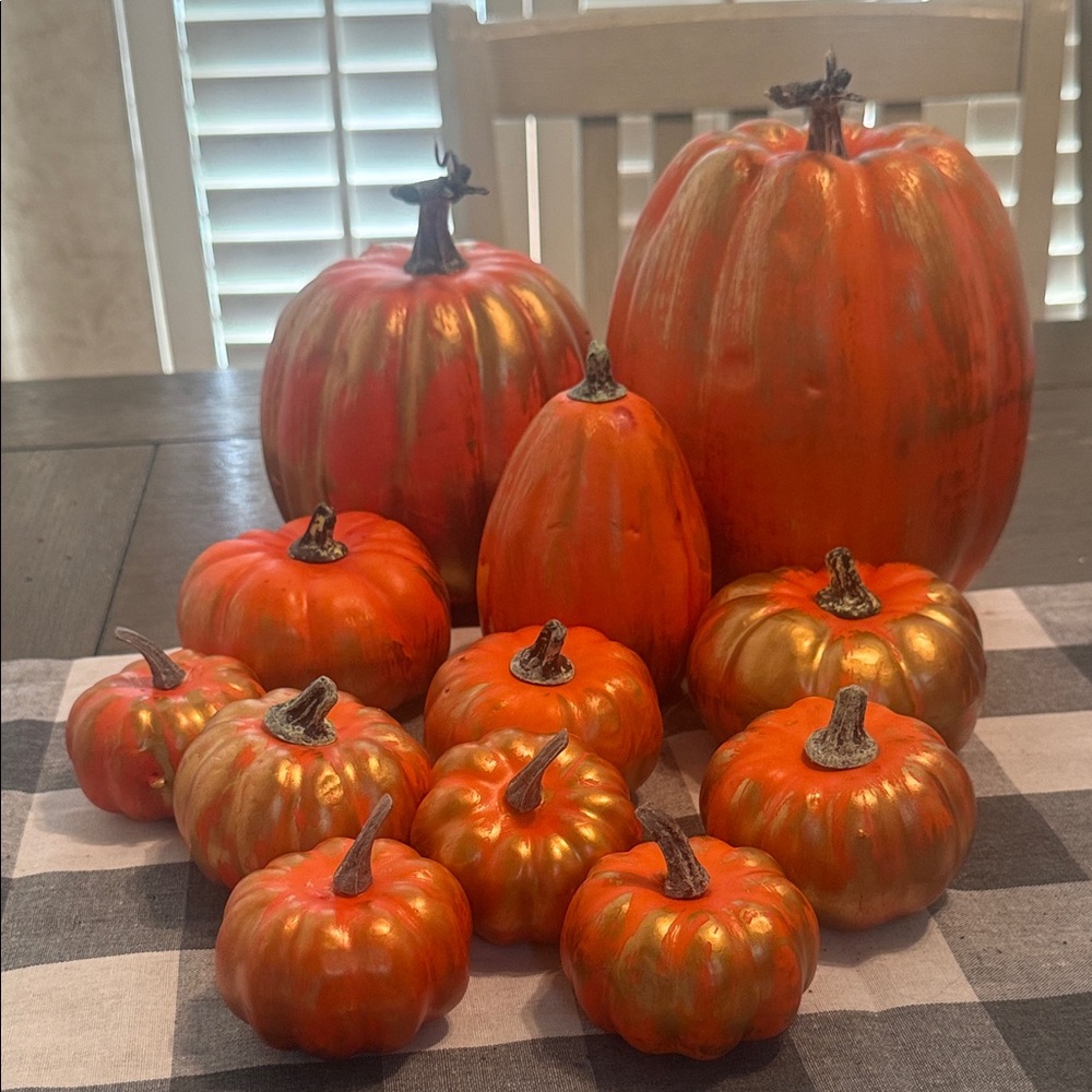 Set of Decorative Orange and Gold Pumpkins .